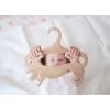 Child is holding wooden clothes hanger closeup