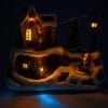 giostrina-piccola Villaggio natalizio luminoso con trenino e Babbo Natale – decorazione con luci calde e dettagli invernali