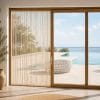 ambientata2-tenda-effetto-carta Tenda antimosche beige per porta finestra vista mare