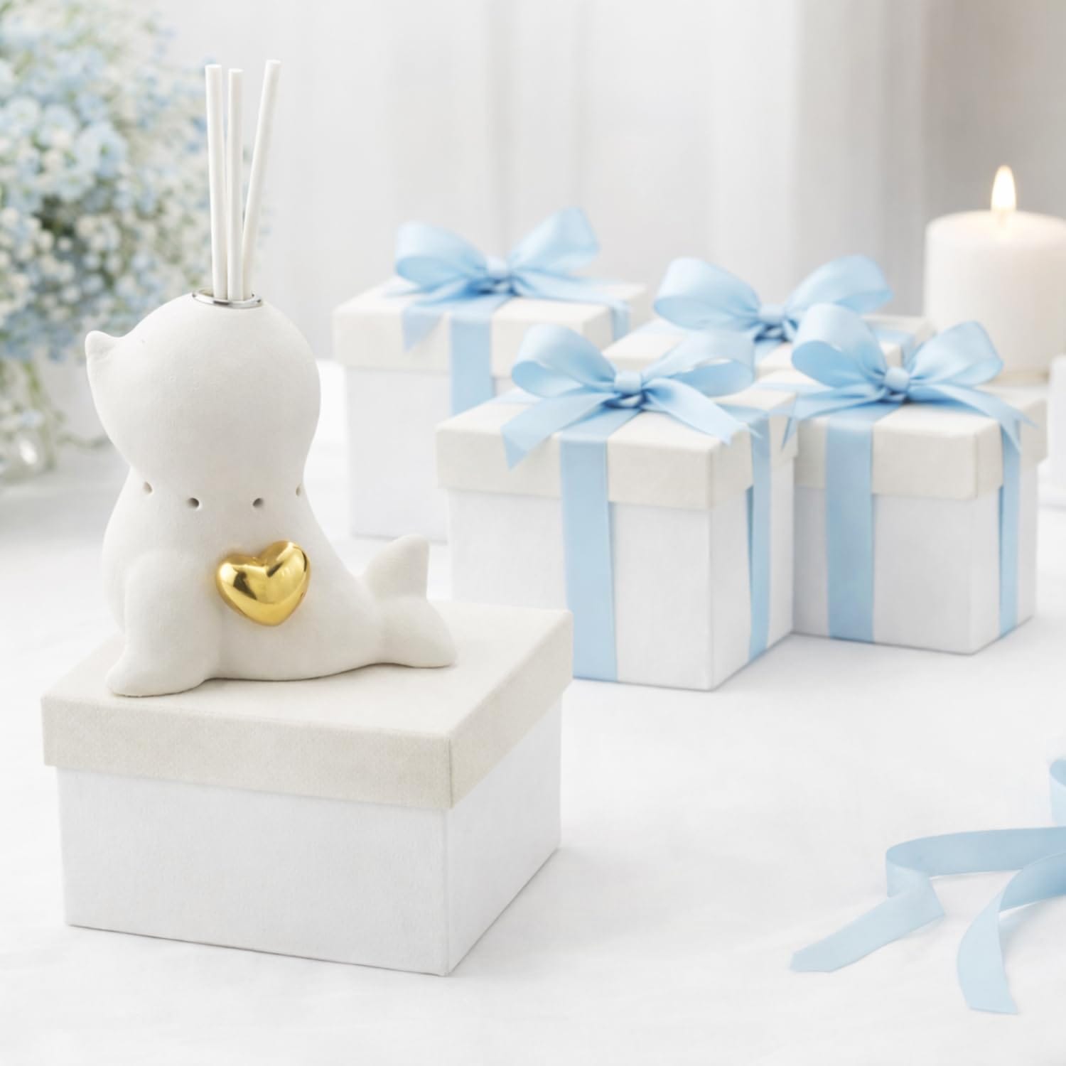 Bomboniera in ceramica forma foca con profumatore e luce LED per battesimo